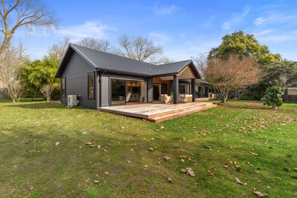 AI home renovation designs displayed on a tablet with construction plans in background